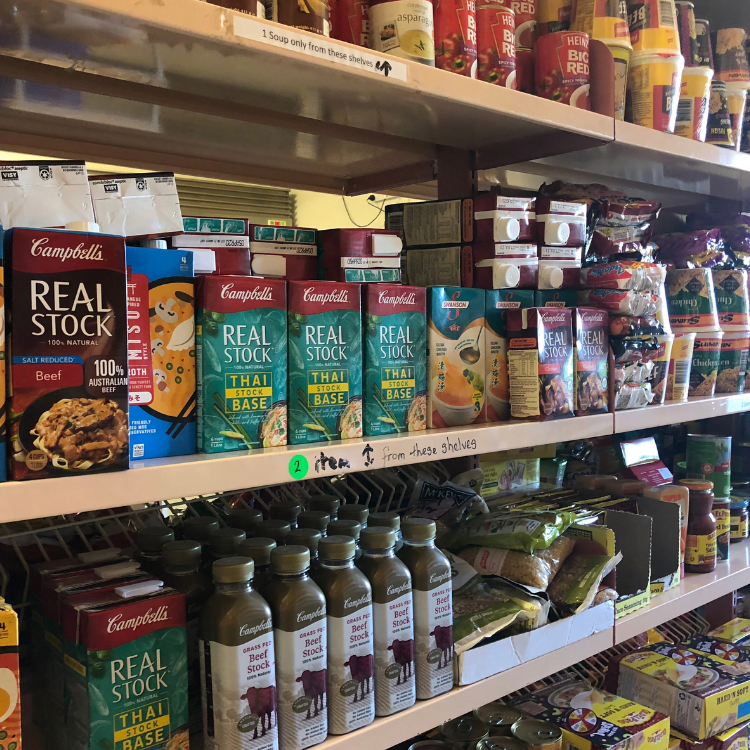 Food items on shelf at foodbank