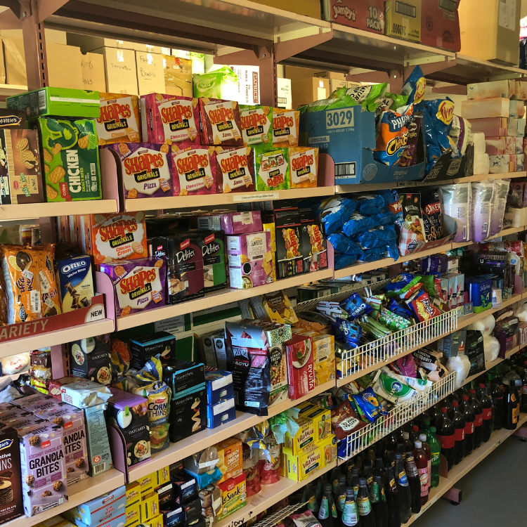 Food items on shelf at foodbank